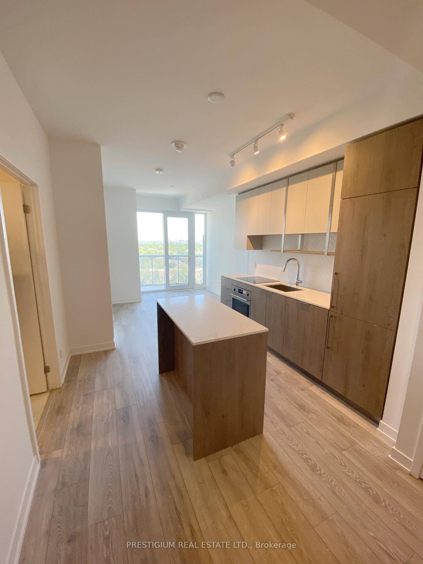This bright and thoughtfully designed 1 bedroom, 475 sq ft suite plus huge balcony features a functional open concept layout with a modern kitchen and island, a spacious bedroom filled ...