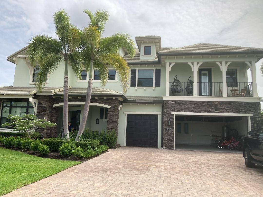 NESTLED IN THE HIGHLY SOUGHT AFTER GATED COMMUNITY OF 'PRADO' IN JUPITER.