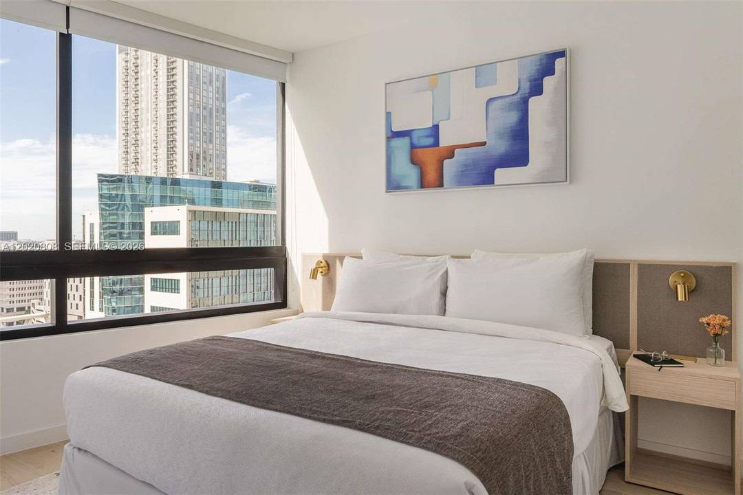 High floor skyline residence with NO rental restrictions at 225 District.