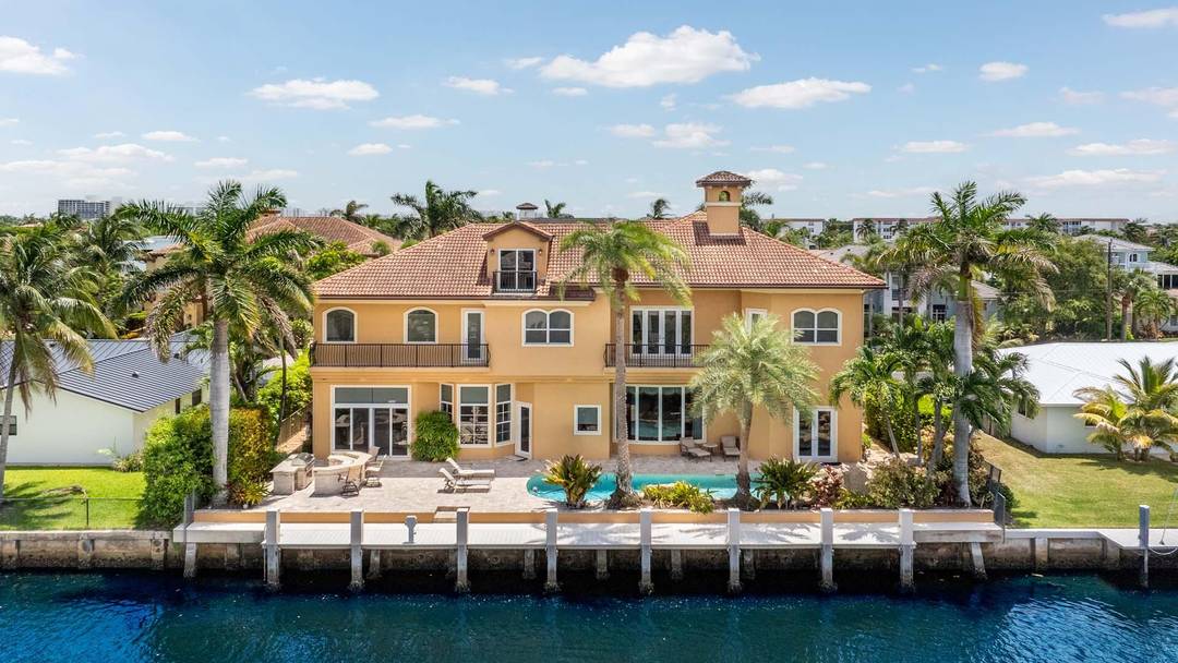Welcome to 929 Banyan Drive, a home that blends timeless craftsmanship with the ease of waterfront living.
