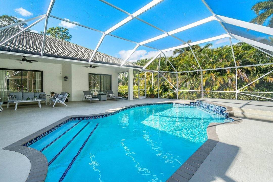 Stunning Tranquil Pool Home in Bay Hill Estates Nestled on a spacious 1.