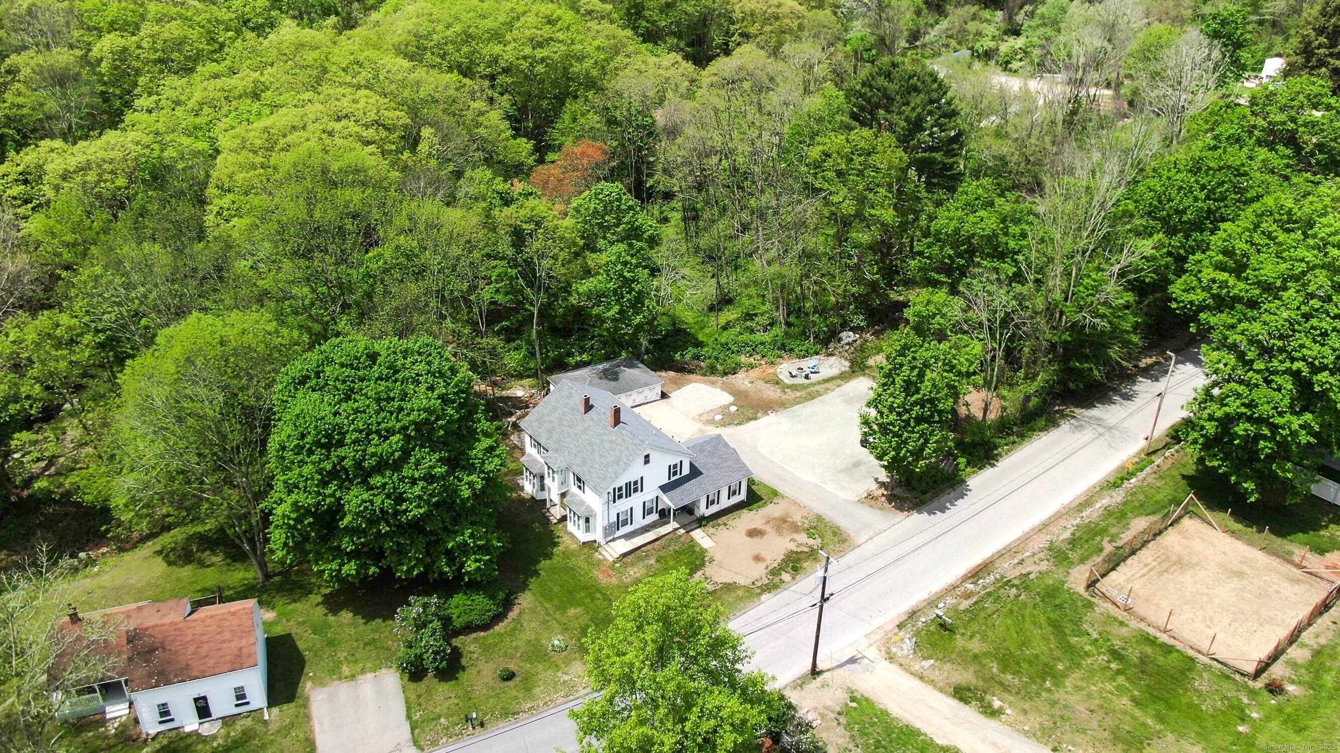 A rare investment opportunity in Pomfret Center, 48 Wrights Crossing Road blends historic New England architecture with reliable modern systems and strong income potential.