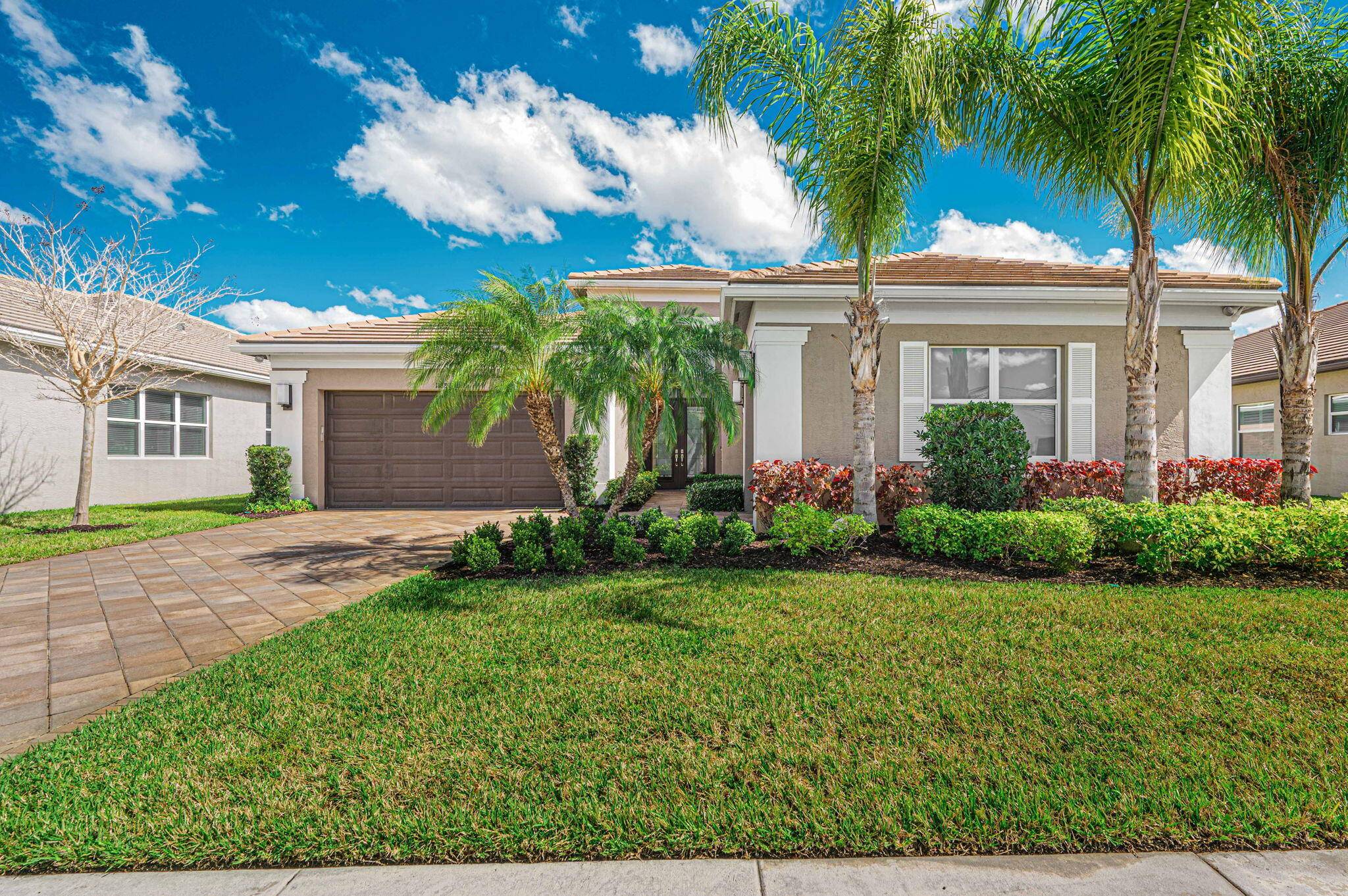 Discover this beautifully upgraded Caroline model in Valencia Cay, a premier 55 community offering resort style amenities.