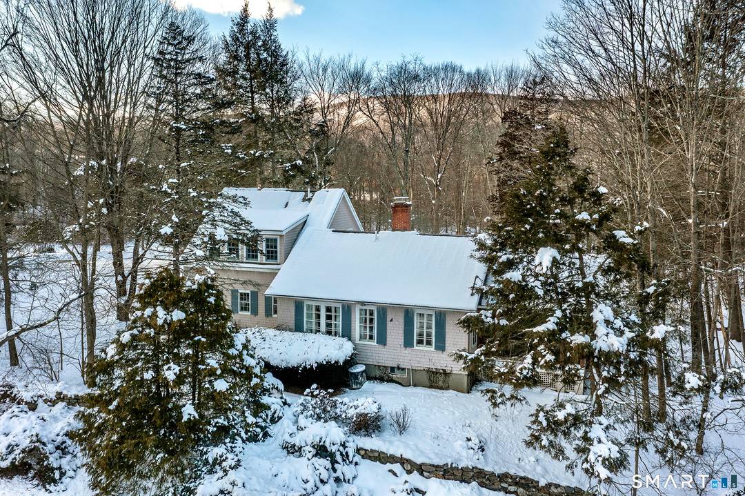 Overlooking neighboring pastureland and set on 5 private acres with a small pond, this three bedroom cottage is rich in charm and character.