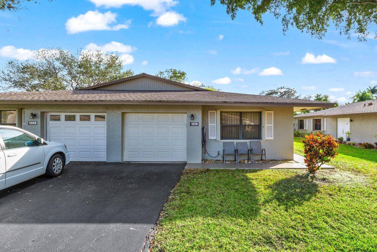 Located in a serene 55 community, 2 bedrooms, 2 bathrooms, an oversized garage, and AC enclosed patio.