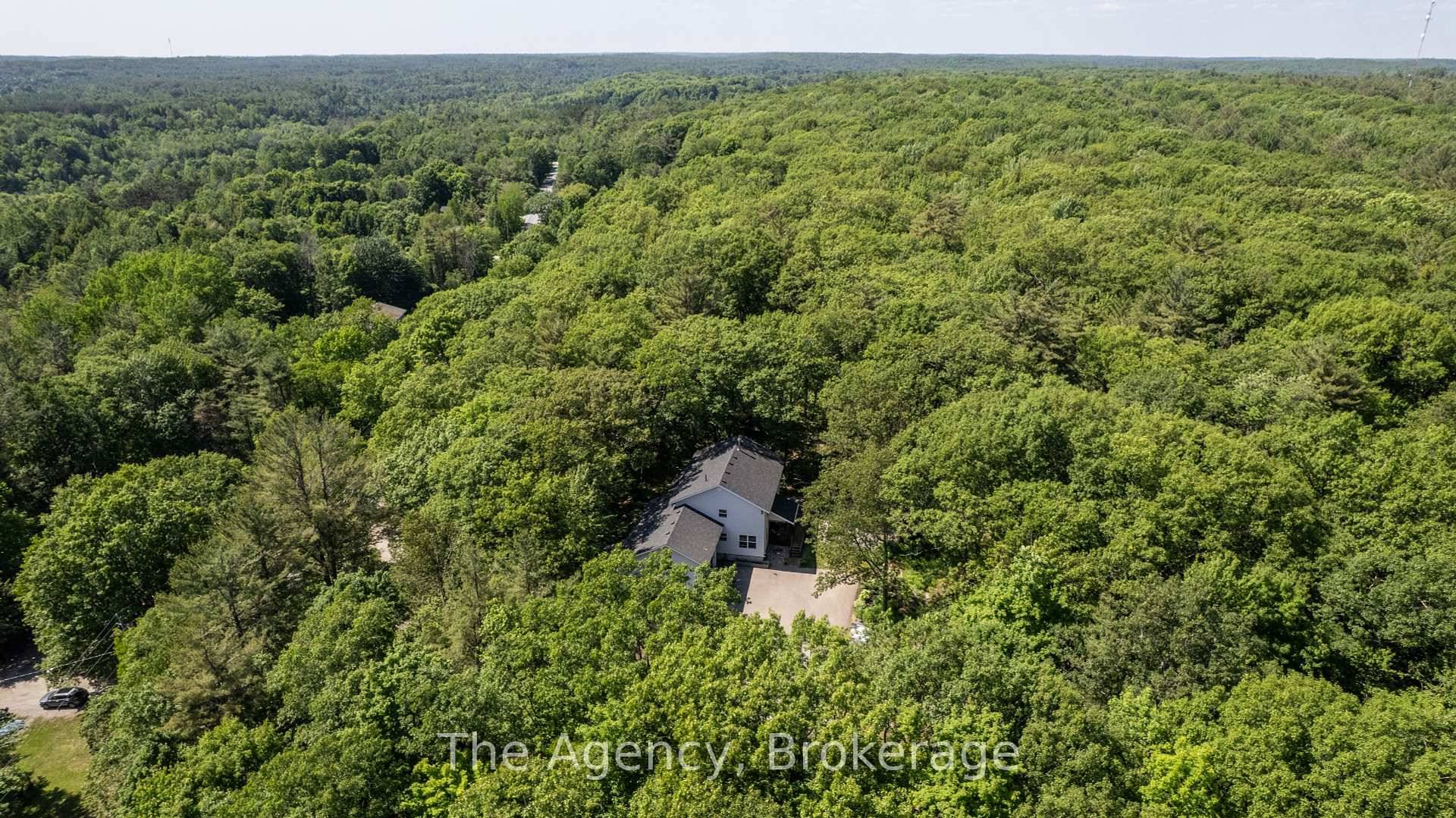 Perched in a private, forested setting just a few minutes from the highly desired Macaulay P.
