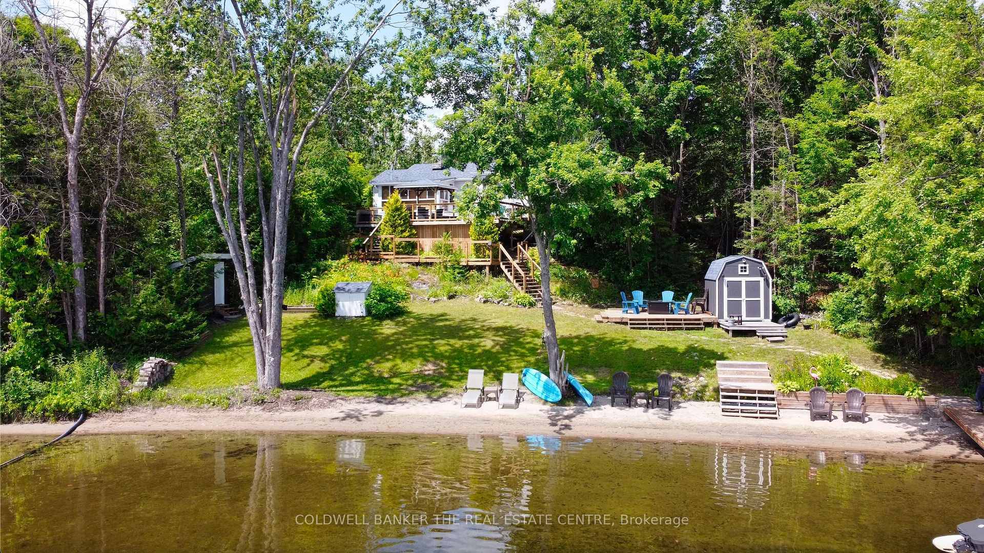 Fantastic Family Cottage on Pristine Shadow Lake offering 150 Ft of Sandy Shoreline !