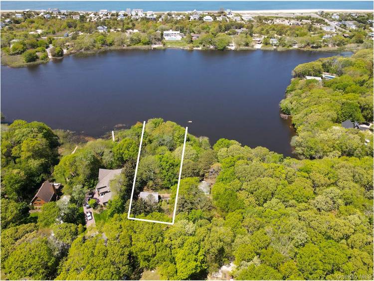 Step inside this charming 2 bedroom, 1 bath bungalow nestled on the serene shores of Great Pond in Southold.