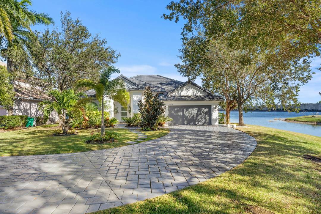 Experience true waterfront living in this professionally designed and fully furnished luxury home offering 3, 344 sq.