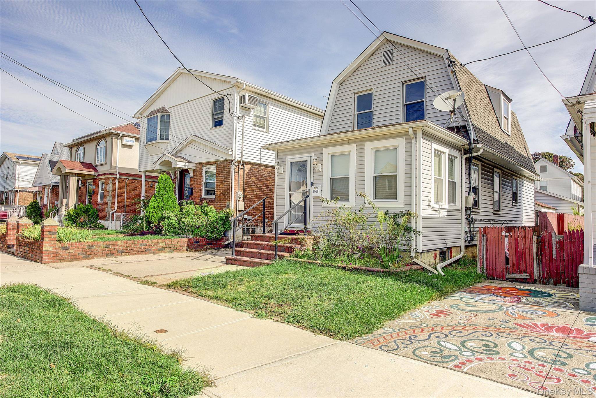 Welcome to this charming, fully renovated two story colonial located in the heart of Jamaica, Queens.