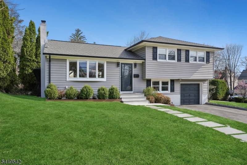 This meticulously updated mid century split level offers the character of a classic home with the systems and finishes of a new one.