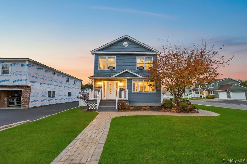 Welcome to this colonial style home at 297 Catskill Avenue in Lindenhurst.