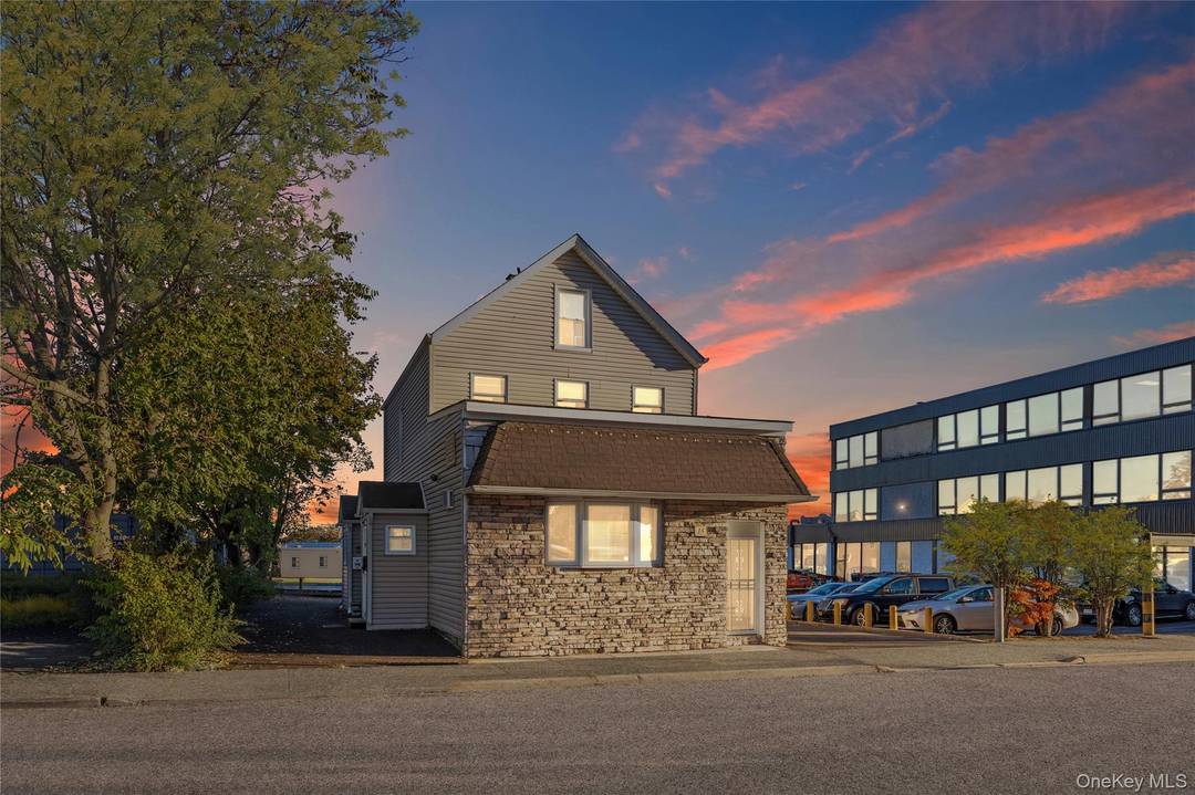 Discover a versatile three story commercial office building with a full basement with outside entrance.