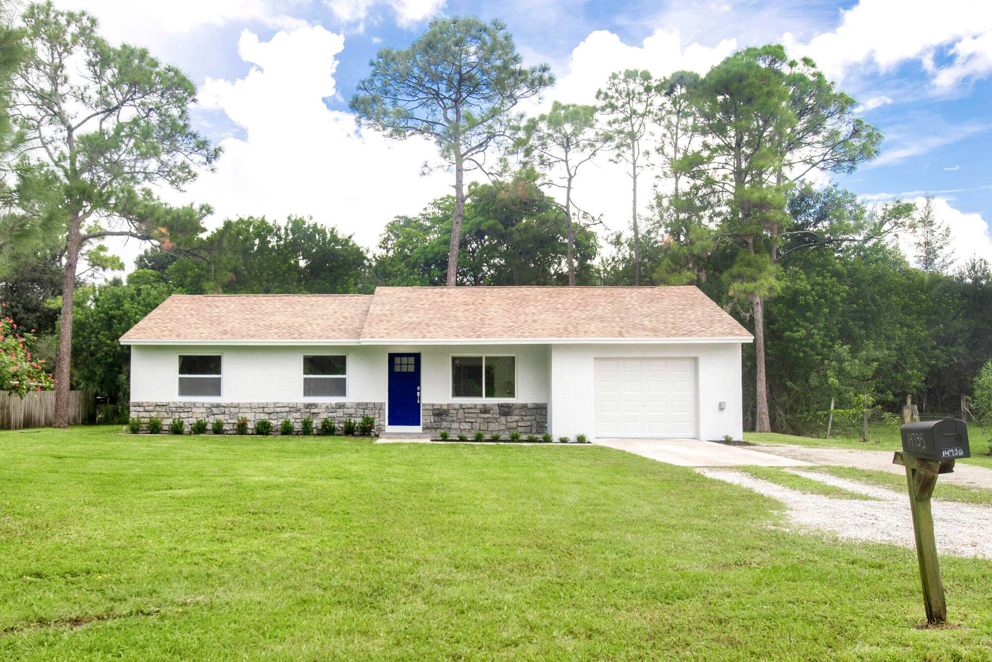 This beautifully renovated 3 bedroom, 2 bath home offers unparalleled privacy and tranquility on a spacious half acre lot.