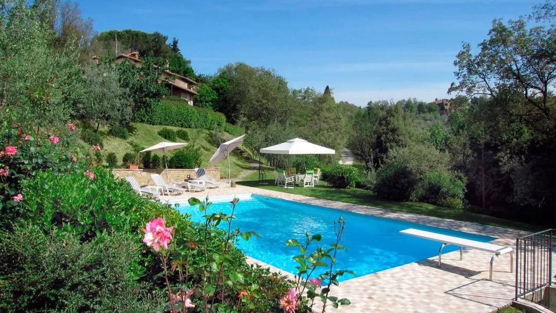 Stone farmhouse with views and swimming pool for sale near the medieval town of Monte San Savino.