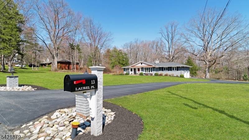 Beautifully renovated Chester home offering the ease of one floor living, thoughtfully updated interiors, and a private, park like setting just minutes from charming downtown Chester.
