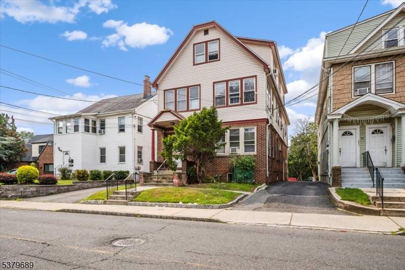 Great opportunity to own a spacious 3 family home on an extra deep lot with room to park 10 cars or expand the existing units check local zoning.