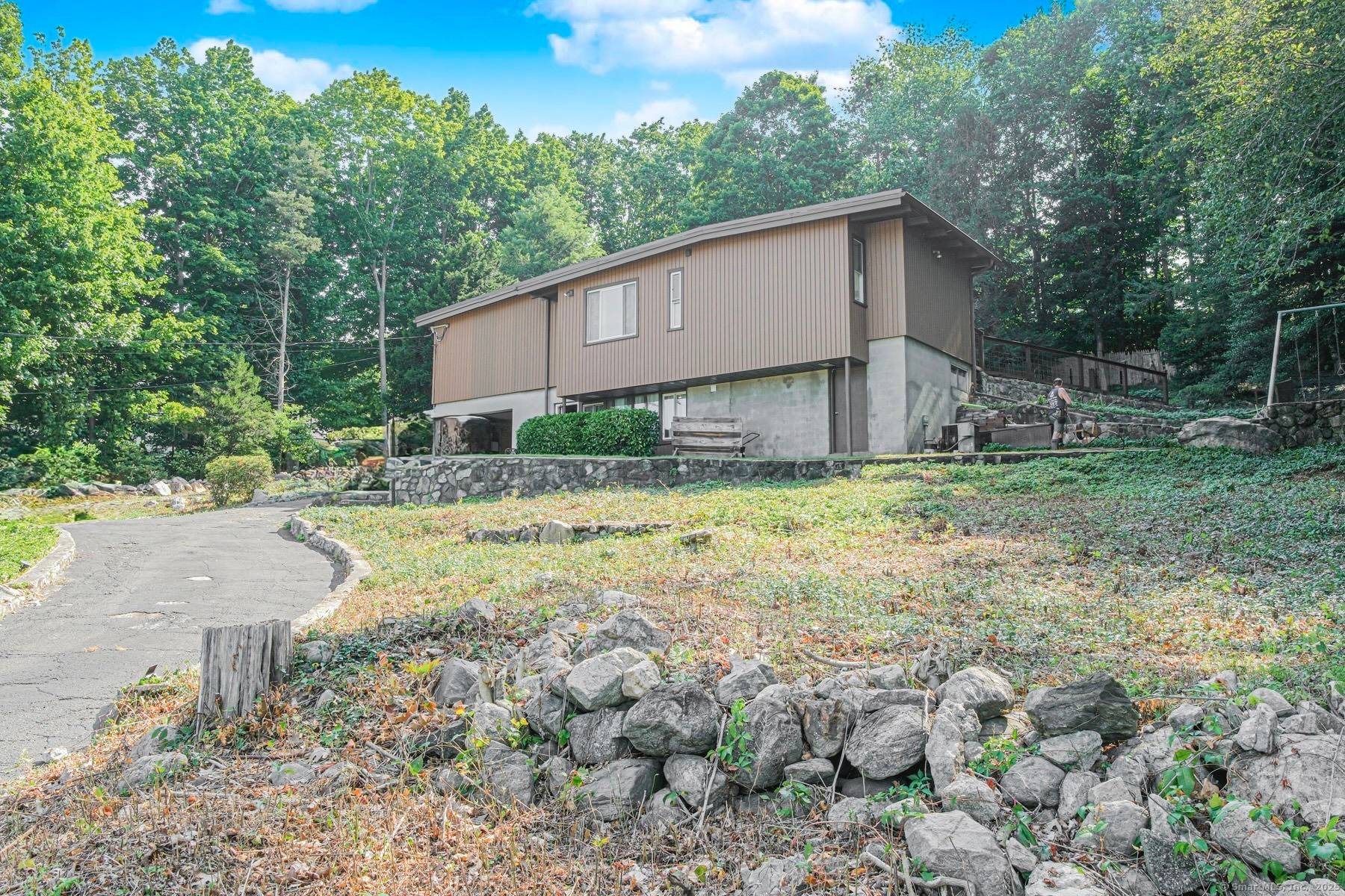 Charming and updated 4 bedroom Colonial set on a beautifully landscaped lot in the heart of Darien.