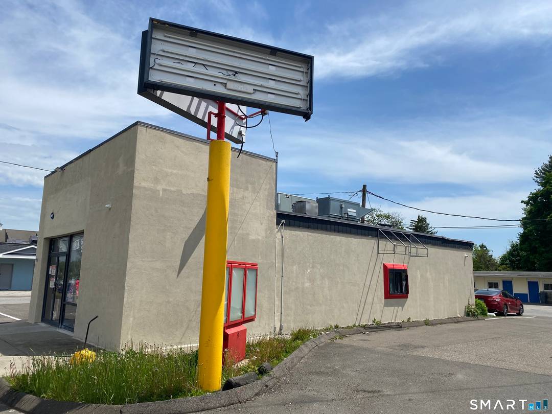 DRIVE THRU WINDOW in a Stand Alone Building situated along a Retail Corridor.