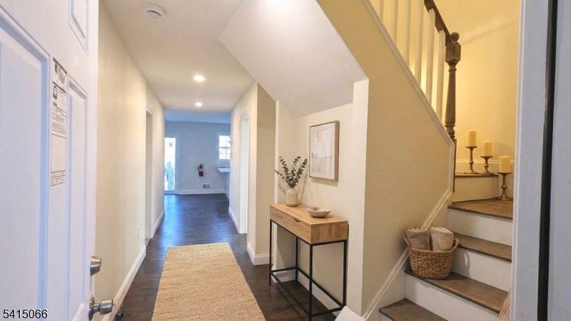 Newer construction legal two family home situated on a corner lot in Bloomfield offering approximately 3, 654 square feet with a flexible multi level layout.