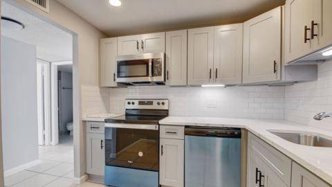 Meticulously maintained 2BR 2BA condo in gated Breakwaters of the Palm Beaches.