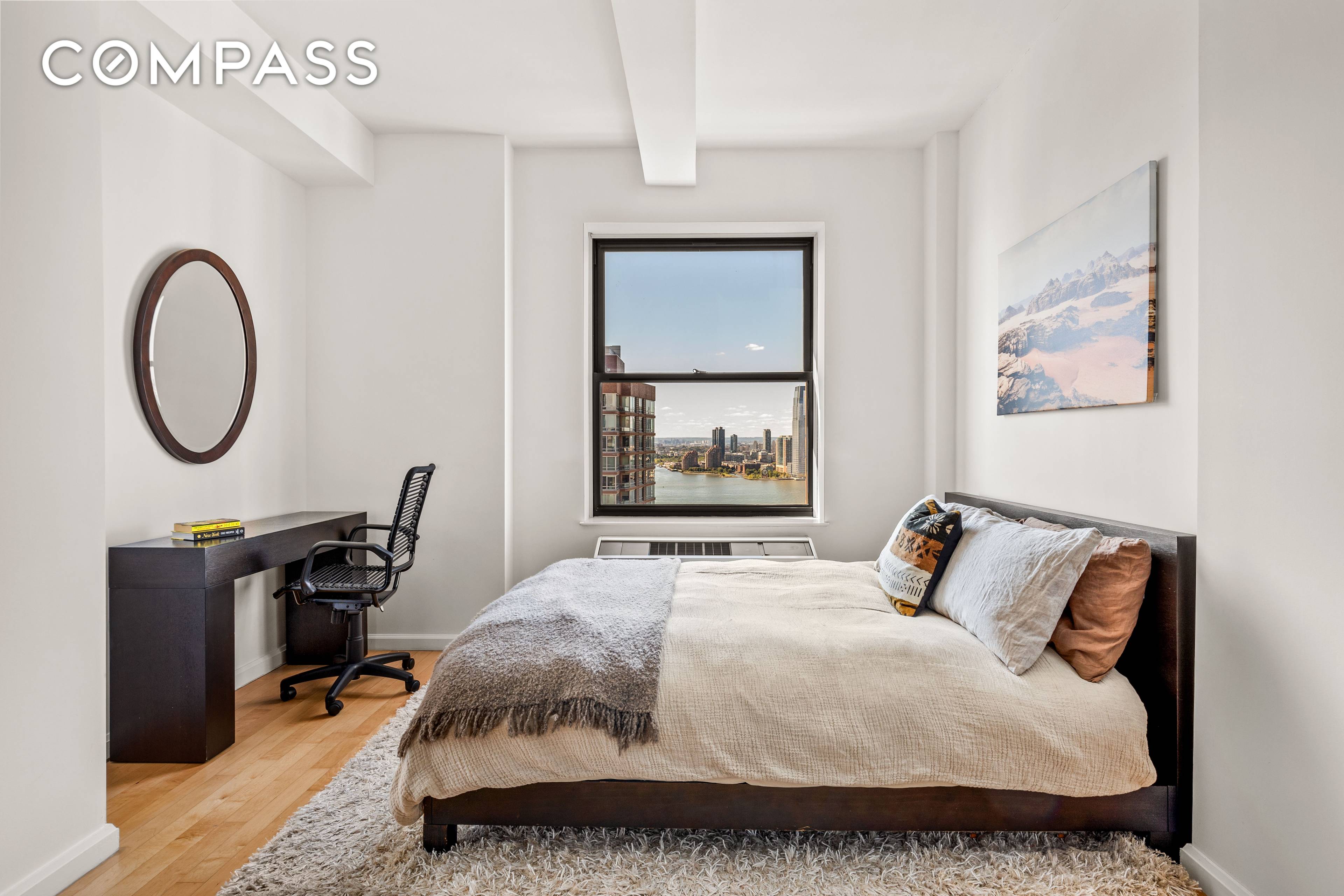 Welcome to Residence 31C, a stunning loft like studio bathed in natural sunlight, offering breathtaking views of the water and city skyline.
