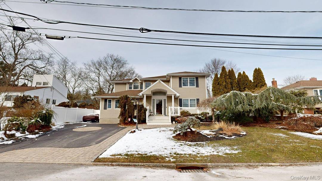 Sophisticated Living with Premium Upgrades in the Heart of Lake Grove !