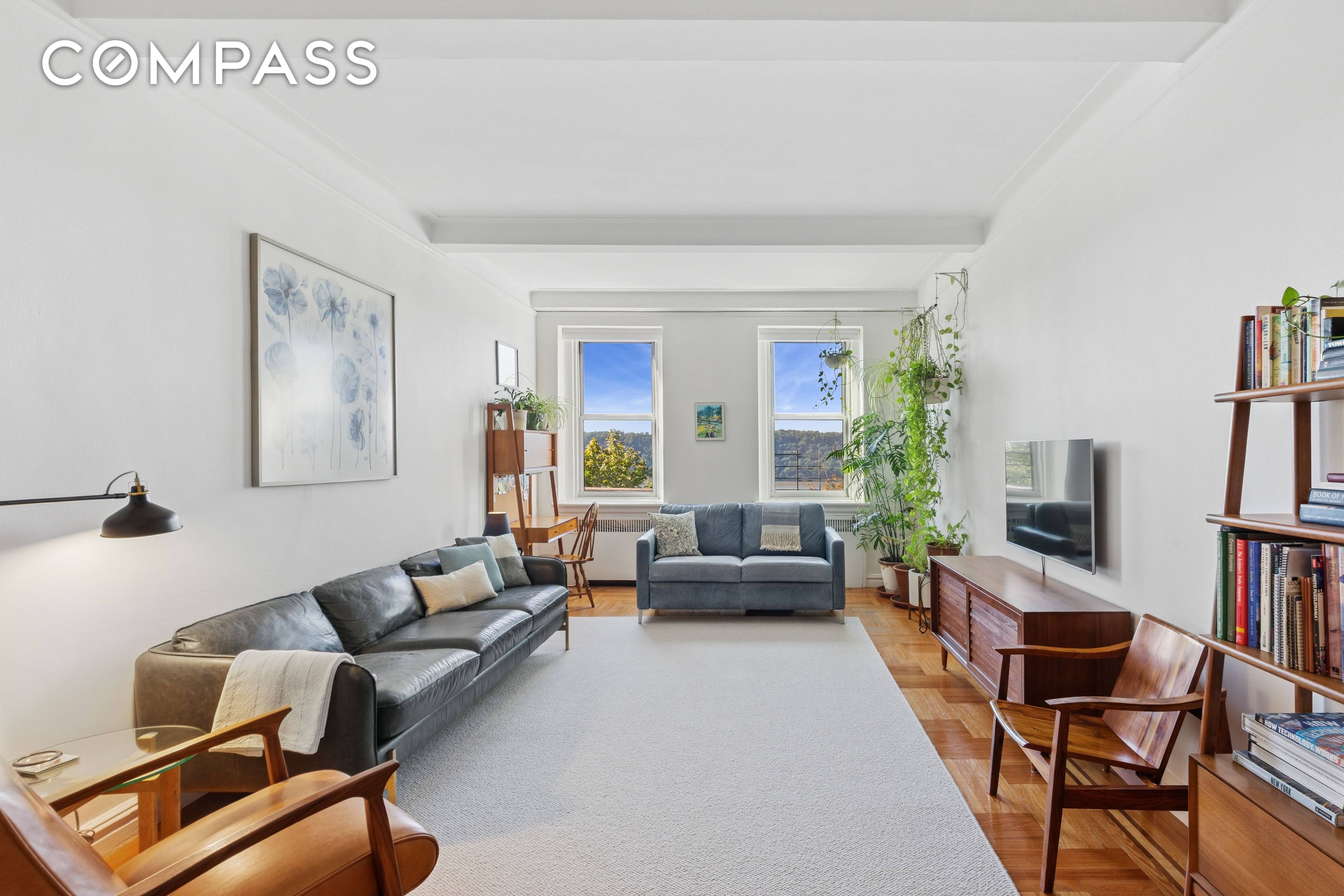 GORGEOUS VIEWS AND COMPLETE PRIVACY This elevated first floor 2 bedroom is perfectly situated to capture open views of the Hudson River, Palisades and the GWB.