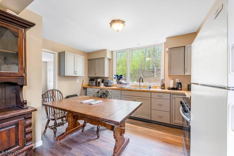 2 Houses on 1 lot ! ! First is a 3 Bdrm Ranch, Formal D R, Lg L R w wood burning FP, EIK, Walk up Attic, Full unf WO ...