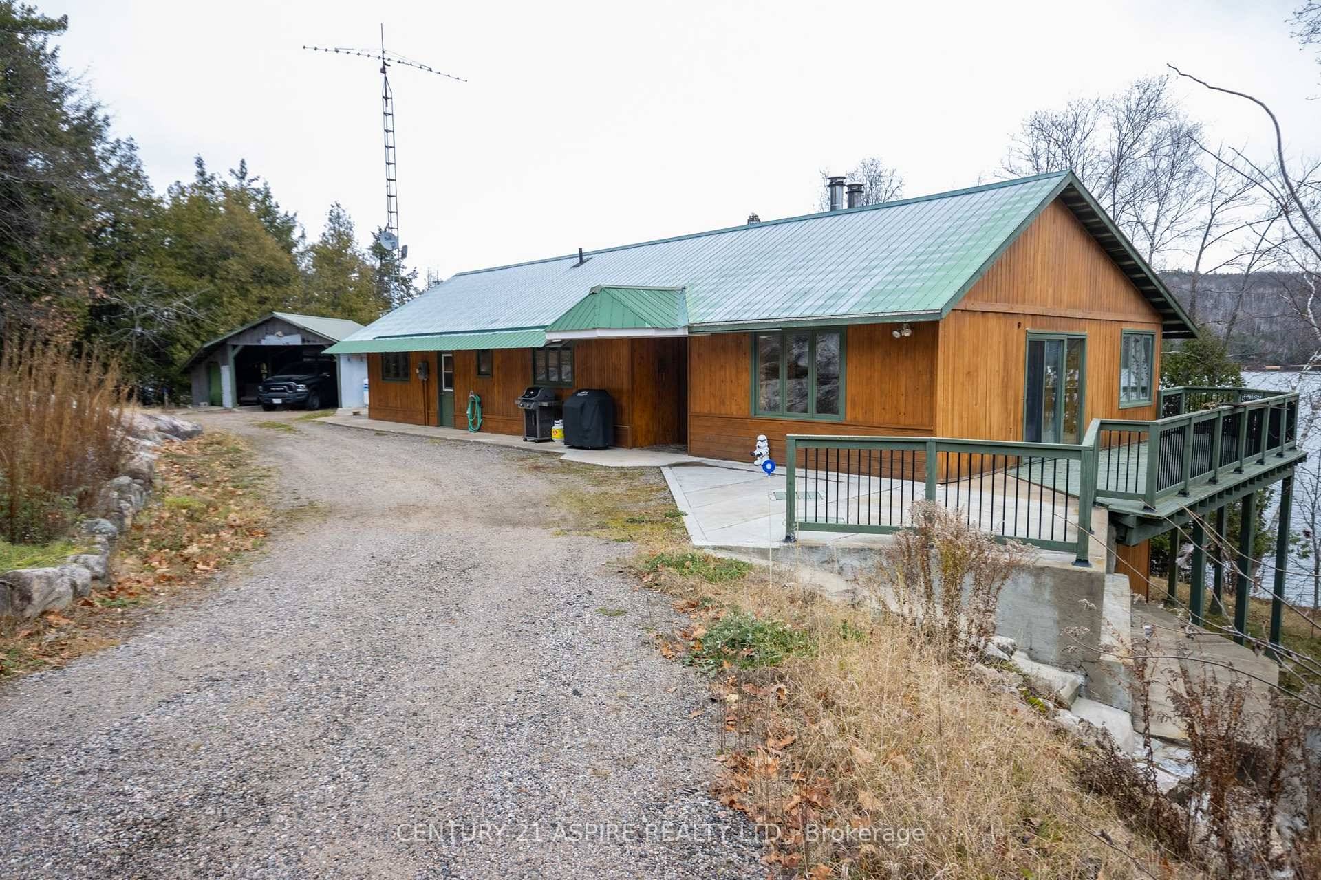Discover serene luxury with this executive waterfront home set on approximately 4.