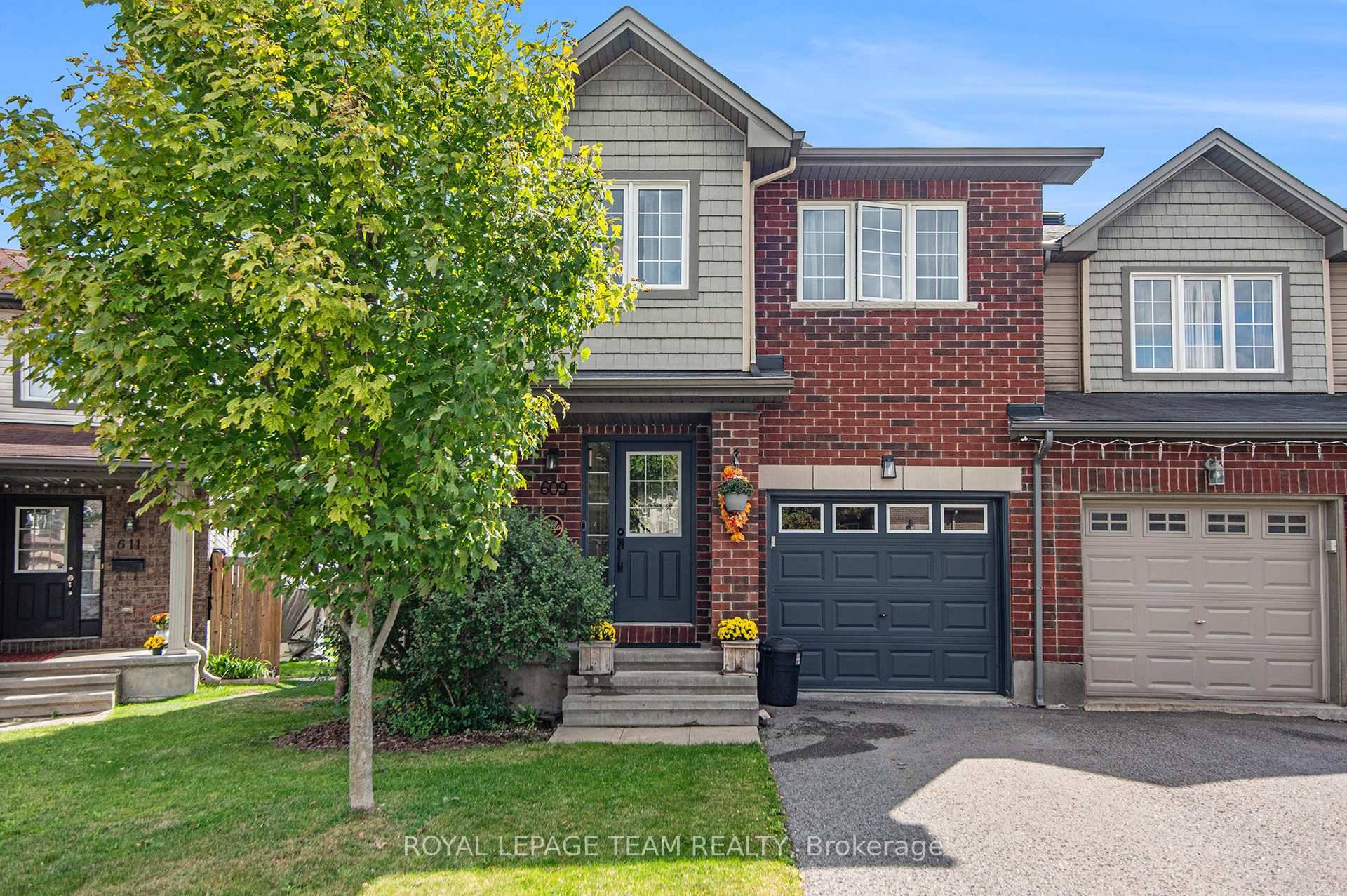 End unit townhome featuring hardwood floors on both levels.