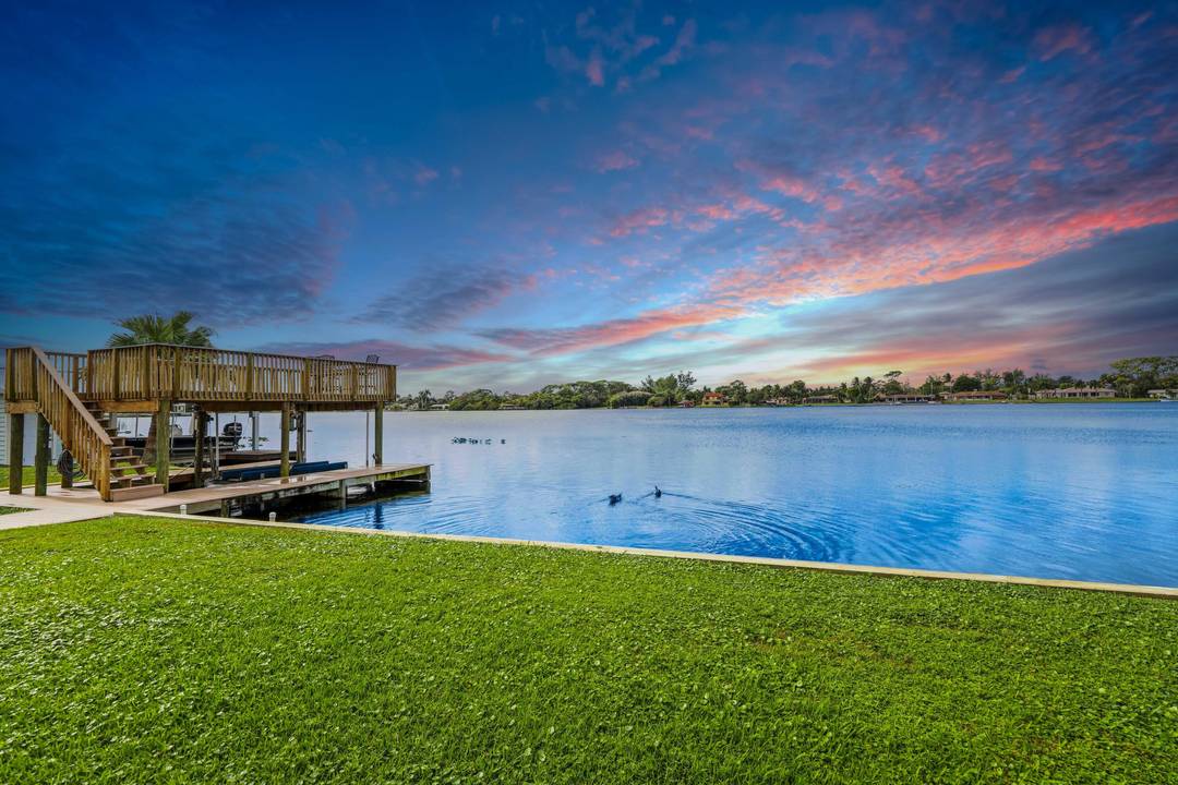 This Lake Osborne waterfront home is a boater's dream with your 2 story TimberTech dock ideal to cruise, paddle, or fish.