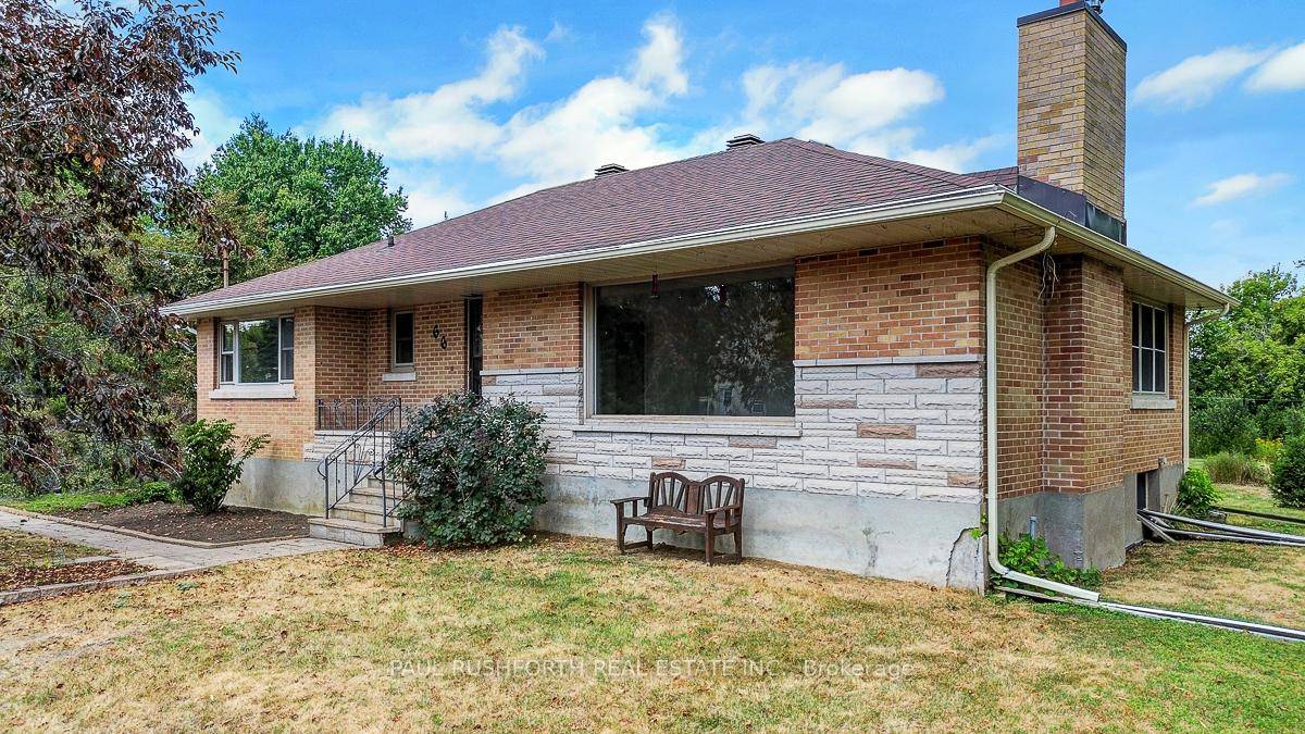 DETACHED BUNGALOW on MASSIVE DOUBLE LOT in booming RICHMOND mere steps to the picturesque Jock River Park on quiet dead end street.