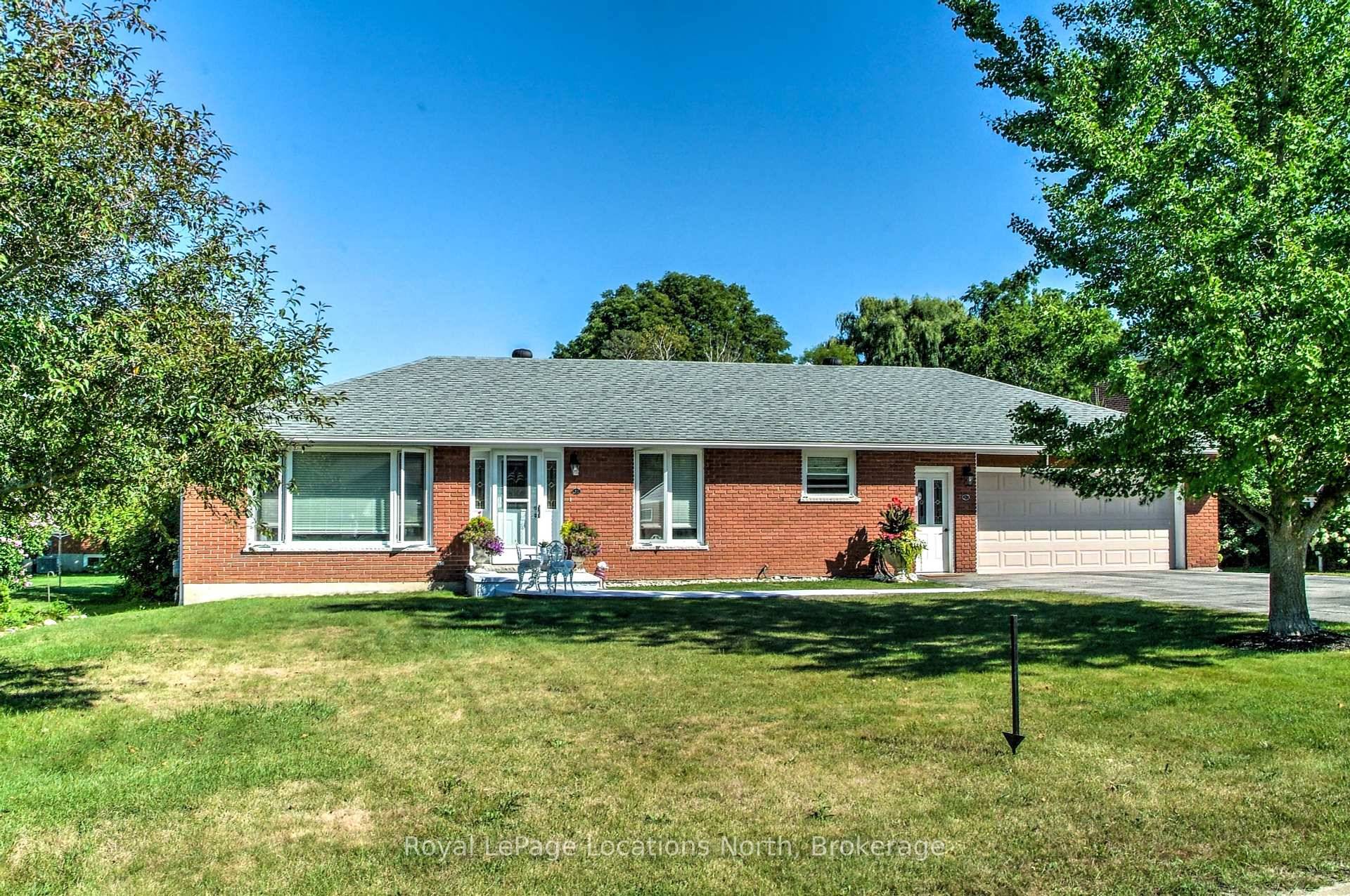 Lovely 3 1 bedroom brick bungalow on a large, fenced lot.