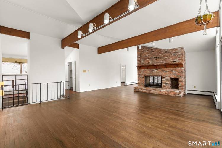 Beautifully updated contemporary style Raised Ranch offering approximately 2, 650 square feet, four bedrooms, and three full baths in a desirable Wilton location.