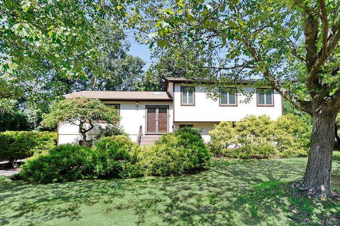 Stunning 2754 SF Custom Contemporary Multi Level Home nestled on 1 2 acre of professionally landscaped property in highly desirable THIELLS MT.