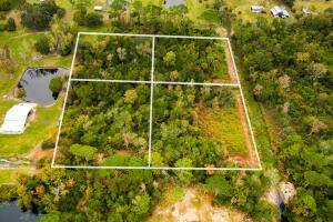 Don't miss this unique opportunity to own 4 acres of mostly cleared land with a 1920 sq ft building 24x80x20 featuring a 16ft roll up door and 18 ft ceilings.