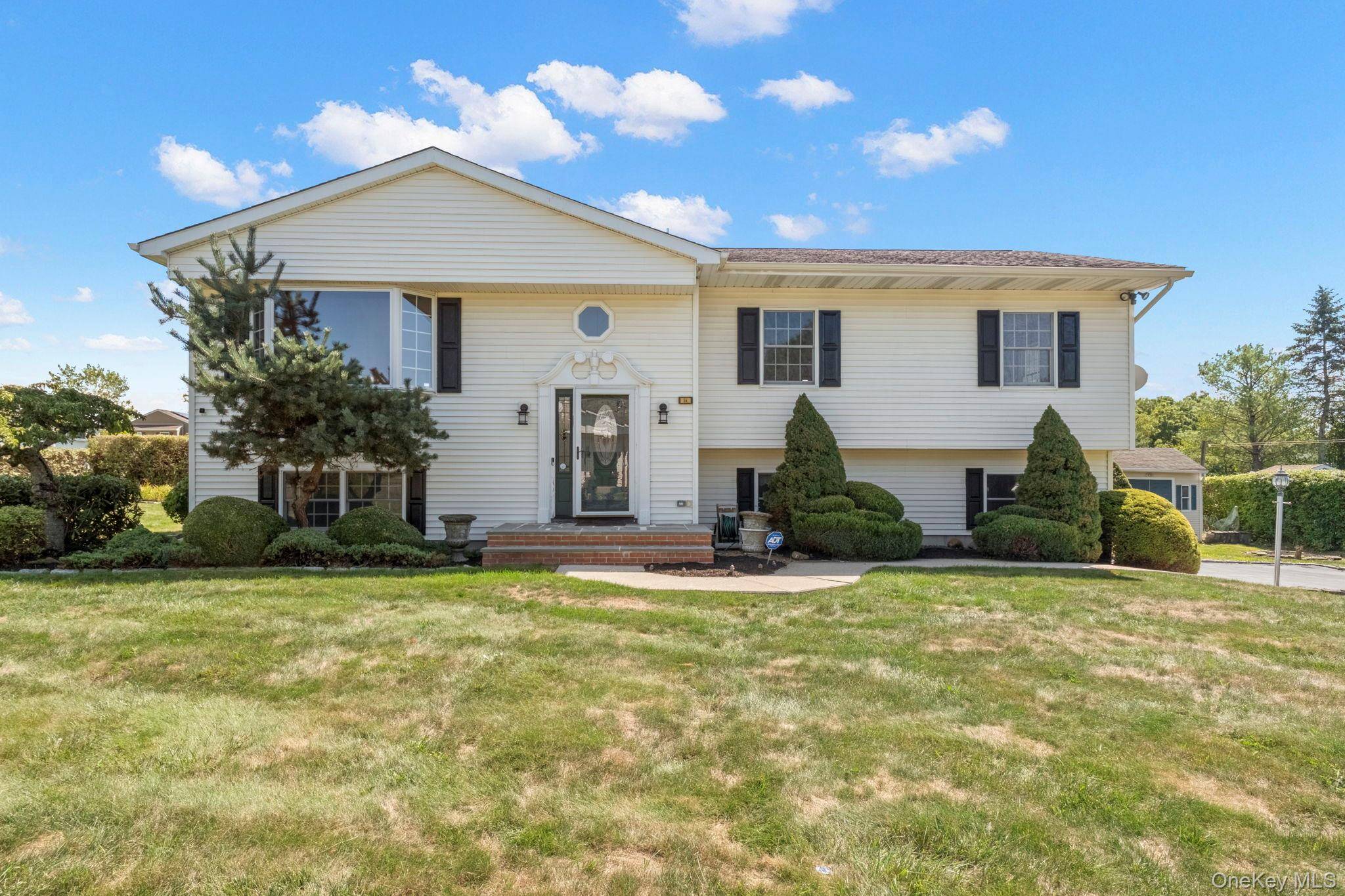 Welcome to 56 Acorn, a four bedroom home situated on a corner lot in a desirable neighborhood.