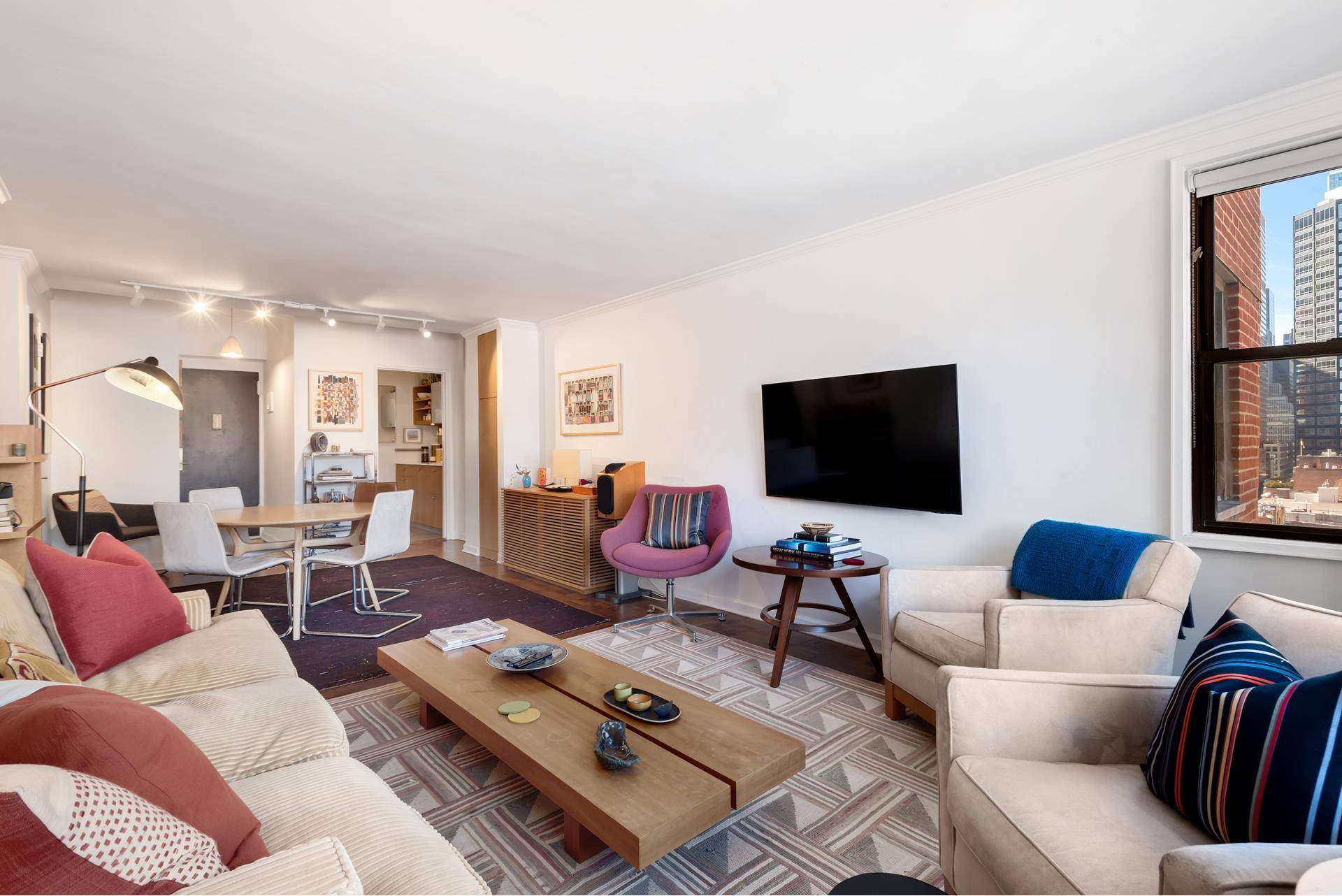 Midtown Magic ! If you've been seeking a large, sunny and cheerful renovated one bedroom apartment in a wonderful full service building in Midtown East, you've just pulled a rabbit ...