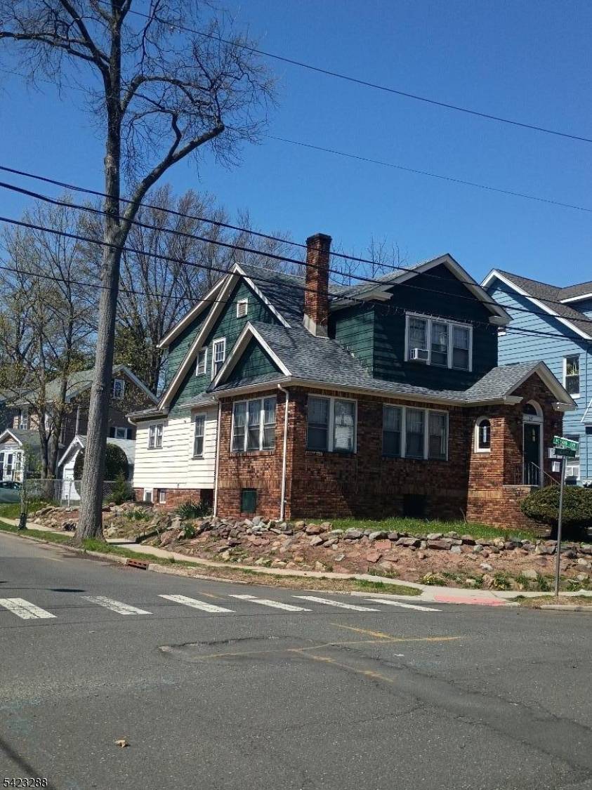 Adorable 2 family house located on a corner lot with a tree lined, low traffic street in an unbeatable location.