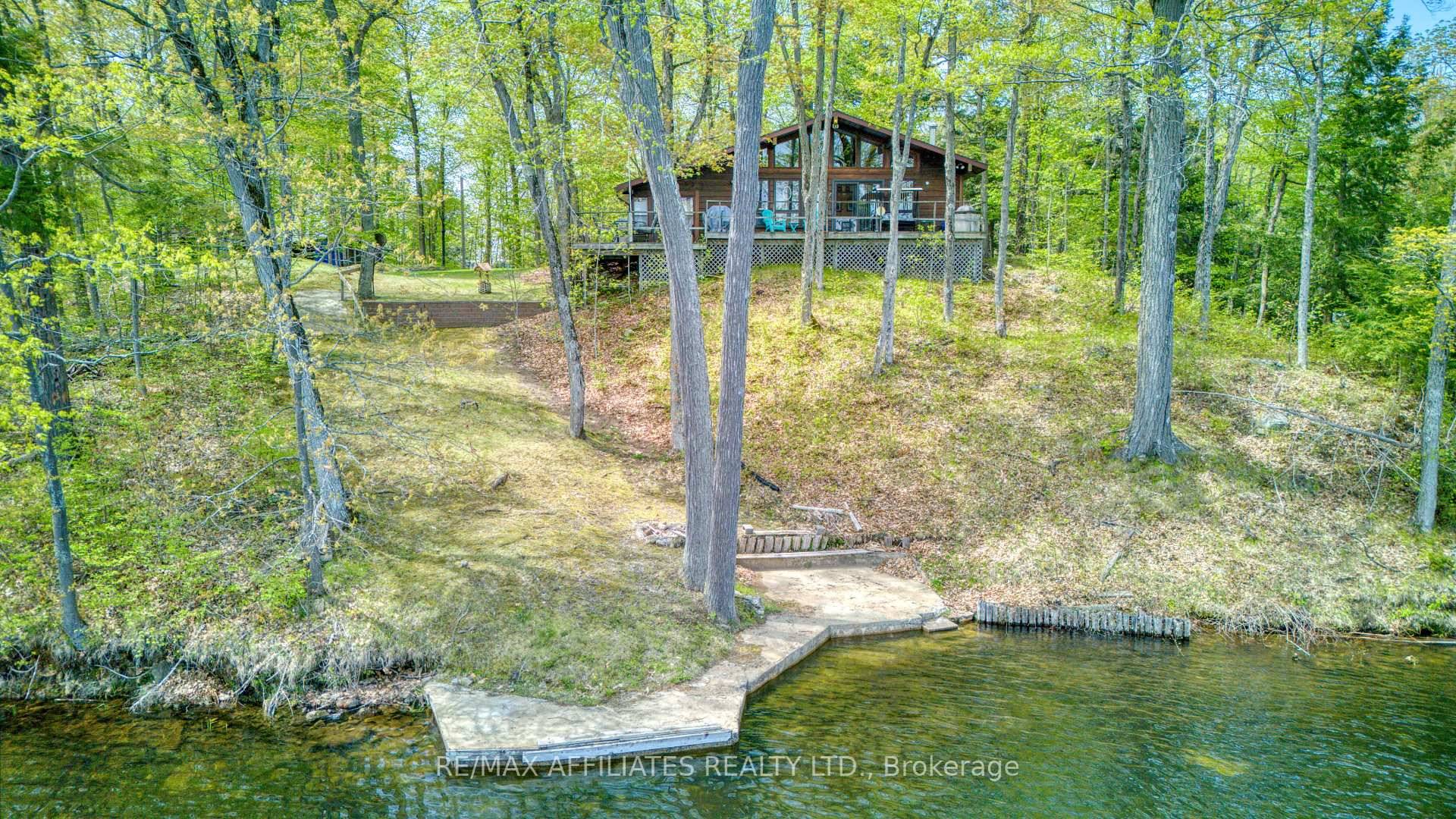 Nestled on the edge of the serene waterfront, this charming one of a kind cottage on one of the best lots I've seen, offers an idyllic retreat.