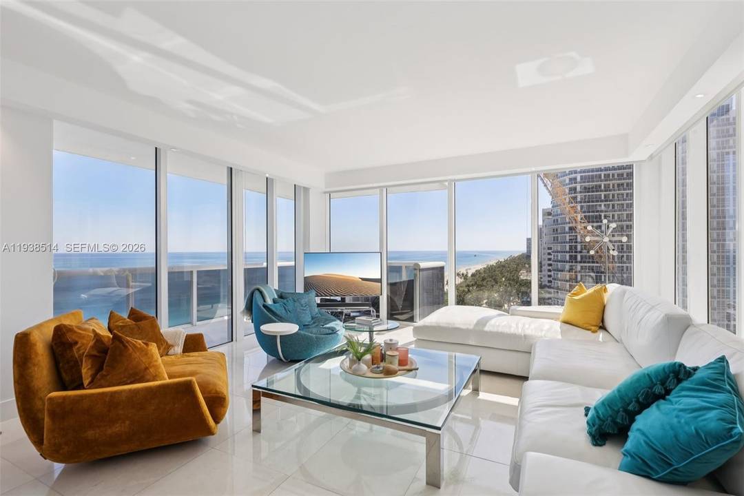 Rarely available wraparound 2 bedroom, 2 bath corner residence offering east south west exposure with breathtaking ocean, bay, and city views.
