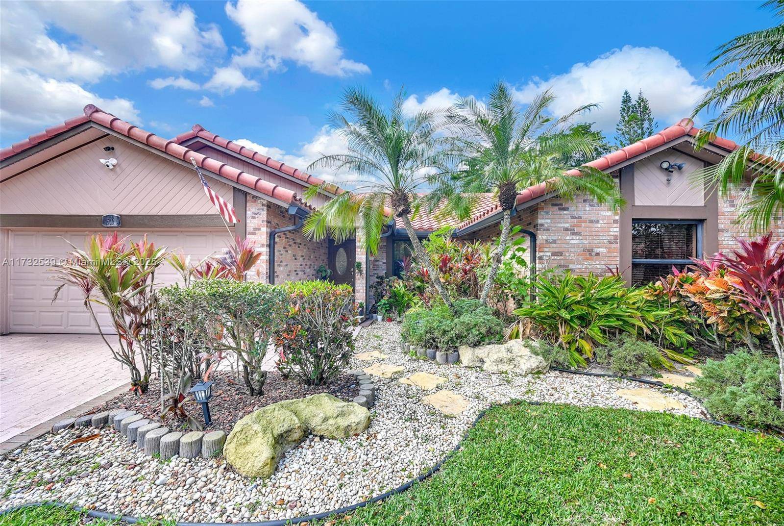 Welcome to this stunning 4 bedroom, 2 bathroom Sun Queen style home in the heart of Coral Springs !