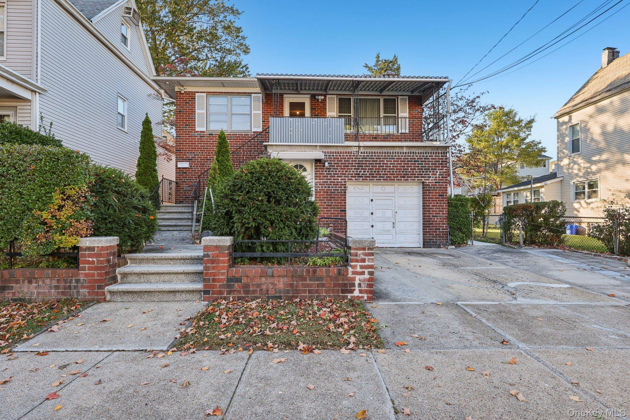Impeccably maintained two family ALL BRICK home in McLean Heights area one block from McLean Ave and all the local shops and restaurants.