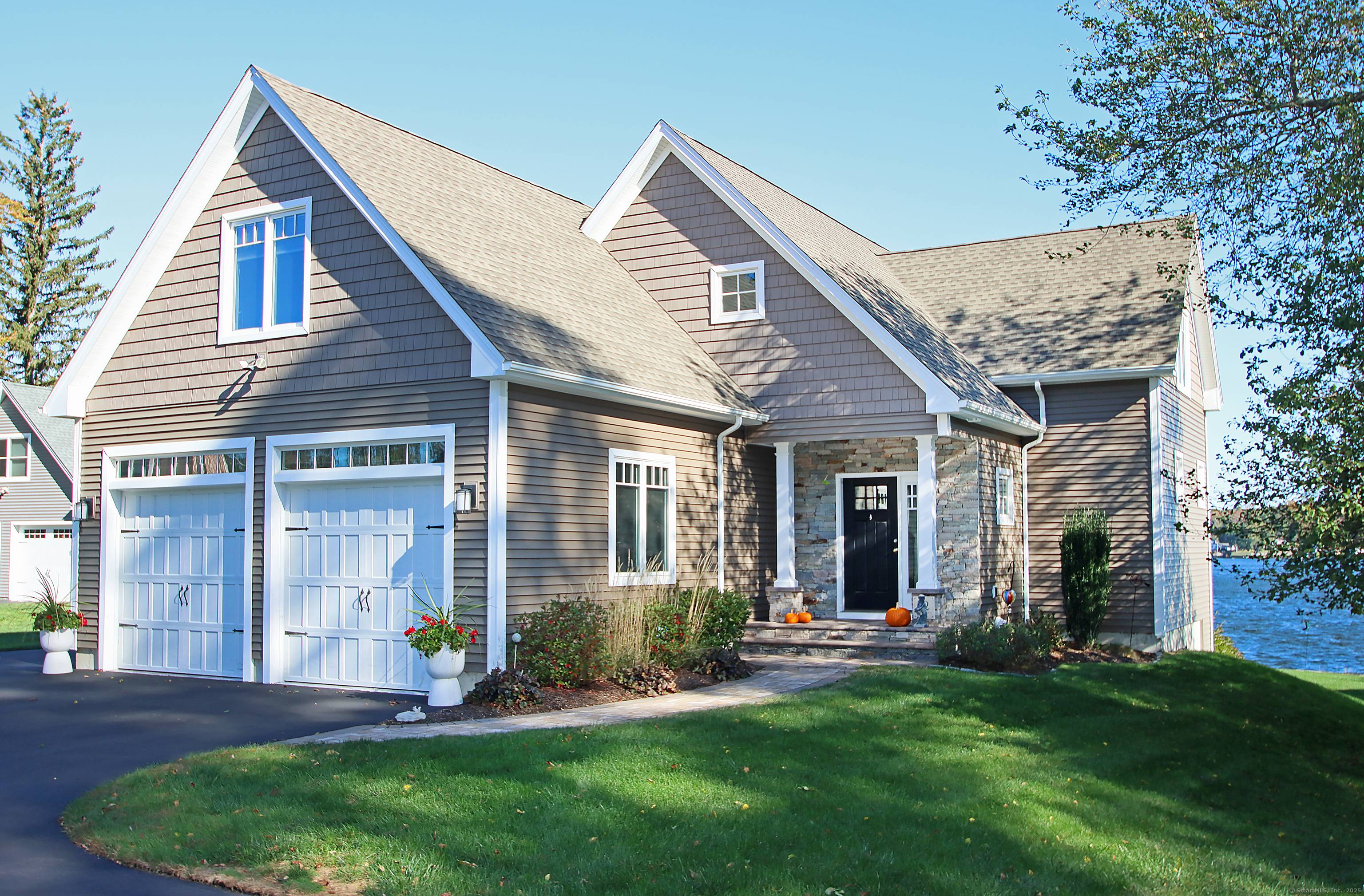 Welcome to this stunning custom crafted home, perfectly positioned on the direct waterfront of the highly sought after Columbia Lake.