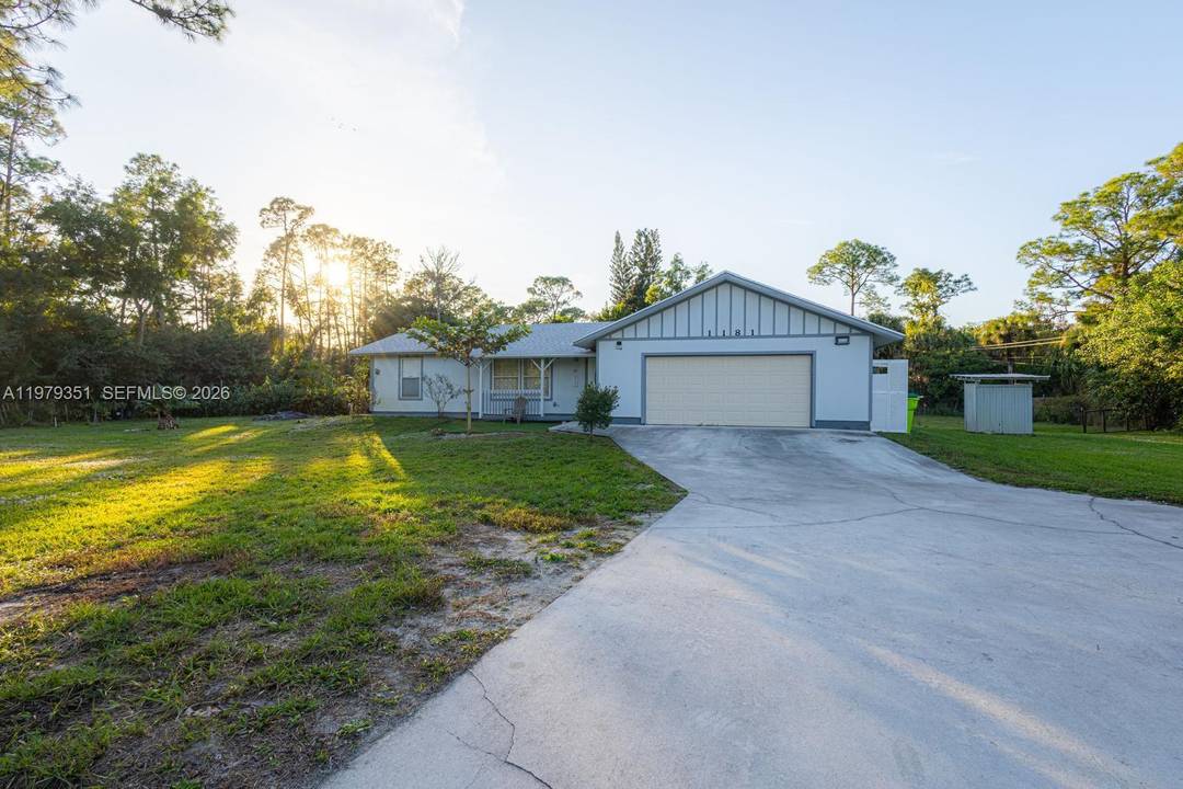 Welcome to this exceptional corner lot property located at 1181 W C Rd, Loxahatchee, FL 33470, offering space, privacy, and true South Florida living.