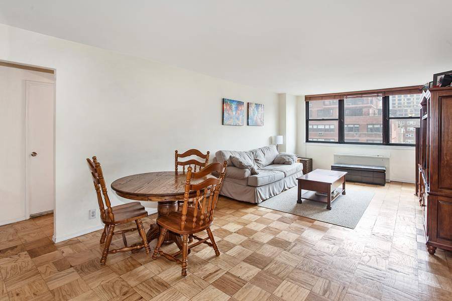 Corner Large 1 Br. with double exposure windows East and West Sun drenched with open views of the city and East River.