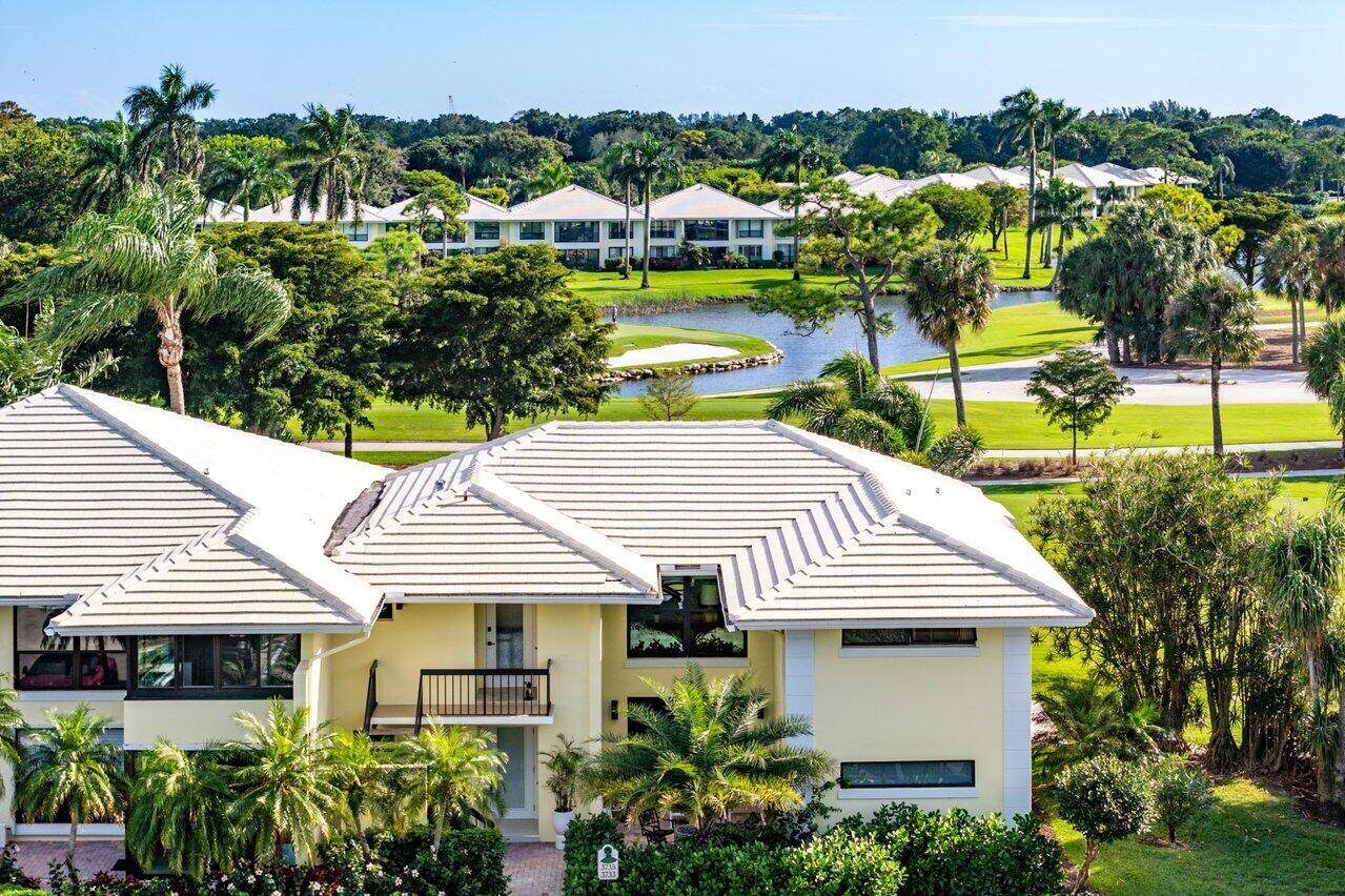Welcome to this beautifully updated second floor residence featuring breathtaking views of 3 golf holes serene lake views.
