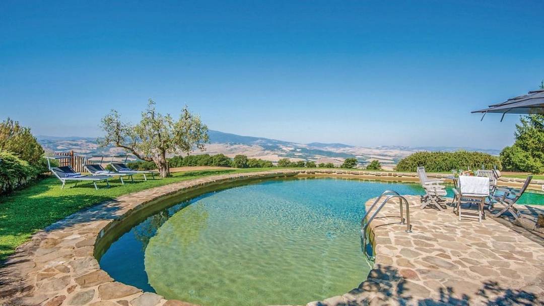 Property with two buildings, outbuilding, pool, garden and 50 hectares of land for sale in Tuscany, in a panoramic position over the Val d'Orcia.