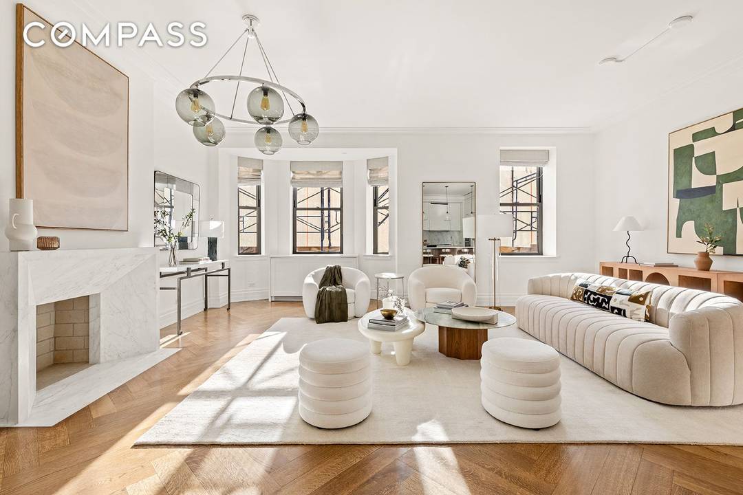 Welcome to Unit 705, a corner residence with a breathtaking, sun filled great room framed by a south facing bay window and a working wood burning fireplace.